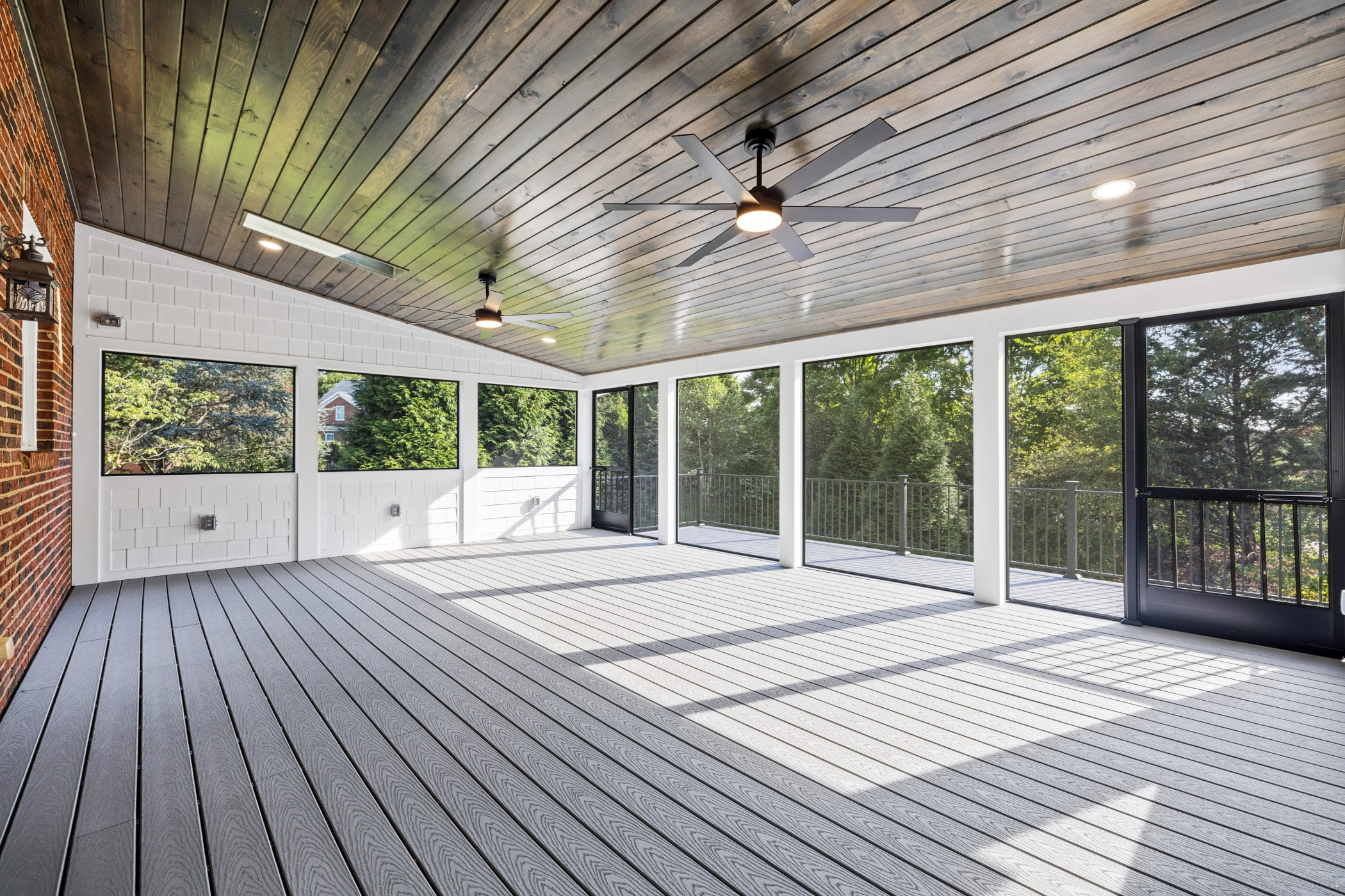 Amberset covered composite deck interior with cable railings