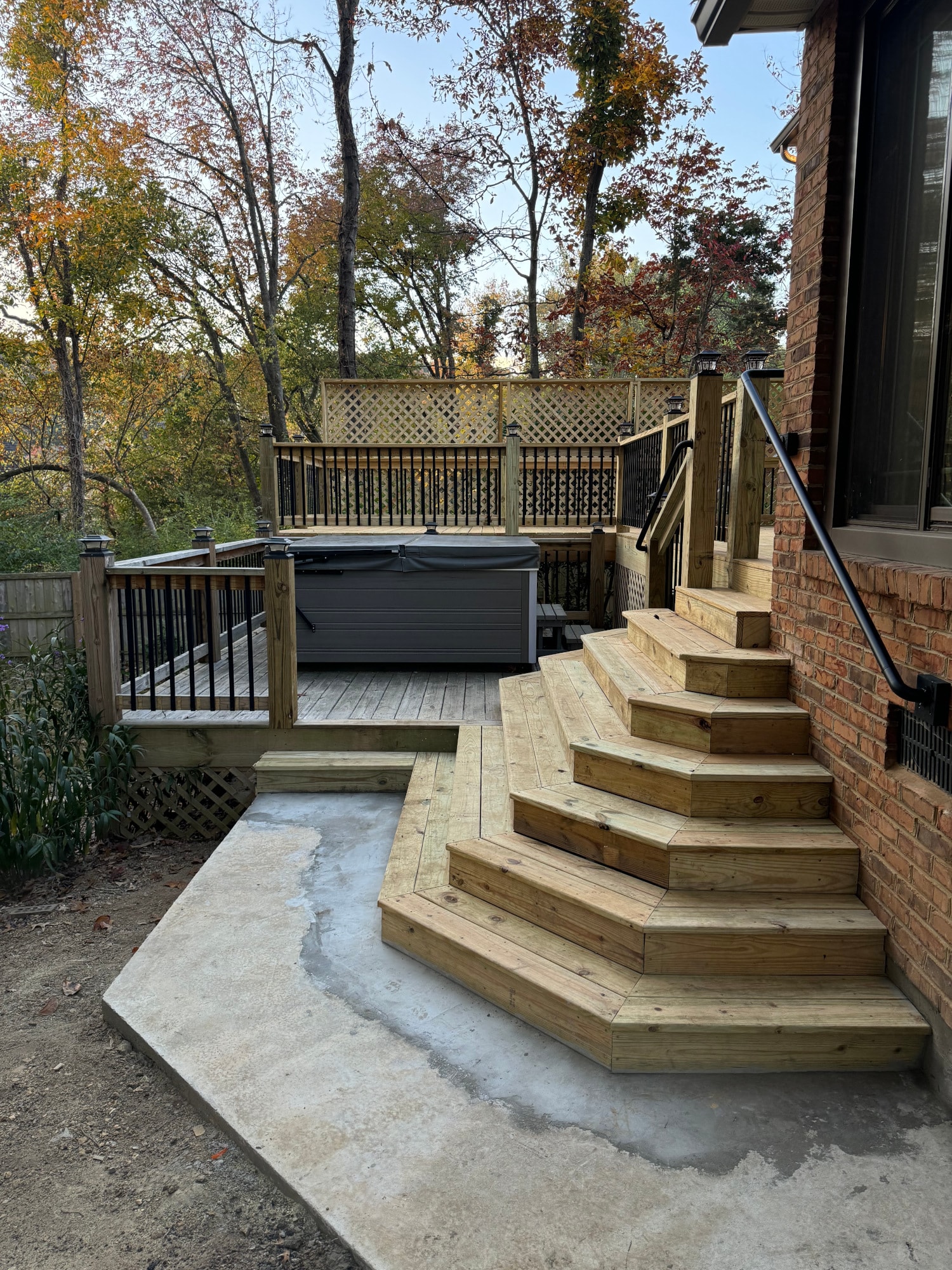 Gatesmill pressure-treated wood deck side view with heavy-duty handrails